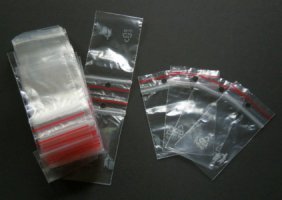 Polygrip salpapussi 40 x 60 mm 100 kpl, o-ripustusreikä